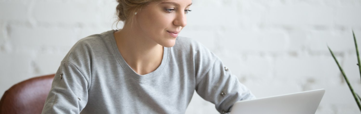 Portrait of attractive student girl at the desk with laptop Portrait of attractive student girl at the desk with laptop