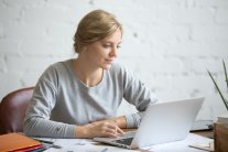 Portrait of attractive student girl at the desk with laptop Portrait of attractive student girl at the desk with laptop